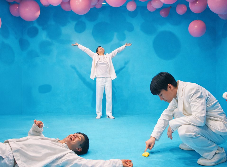 The Haluu team in white overalls working on a blue set