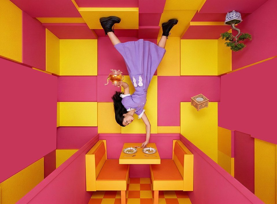 An upside-down room in yellow and pink