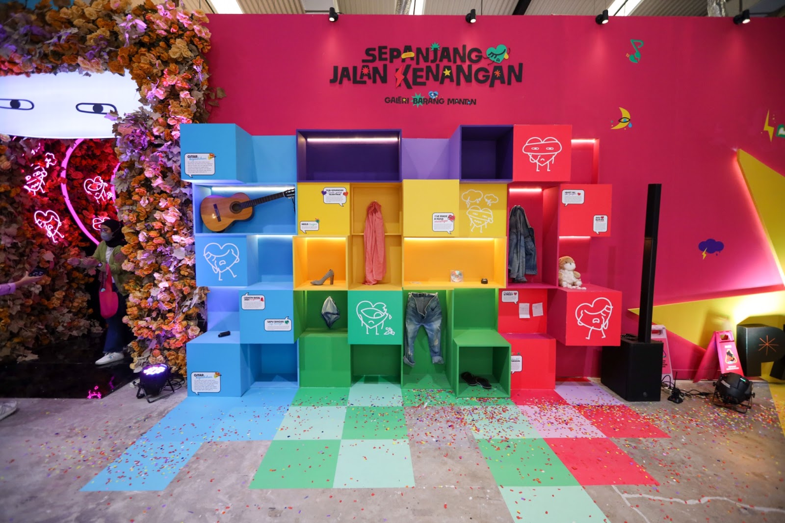 A wall of brightly coloured lockers above a pastel checkerboard floor