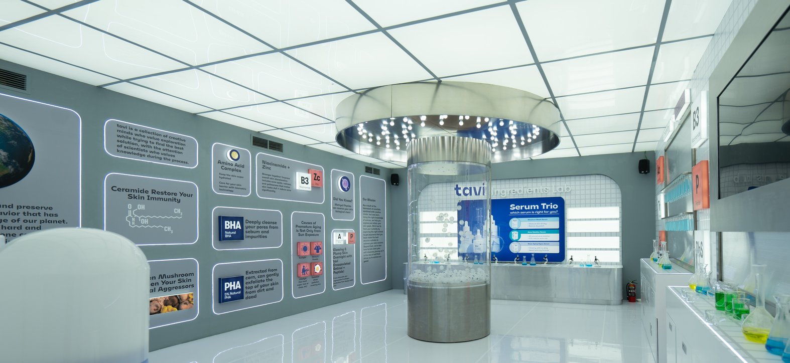 A white exhibition interior lined with product display cases