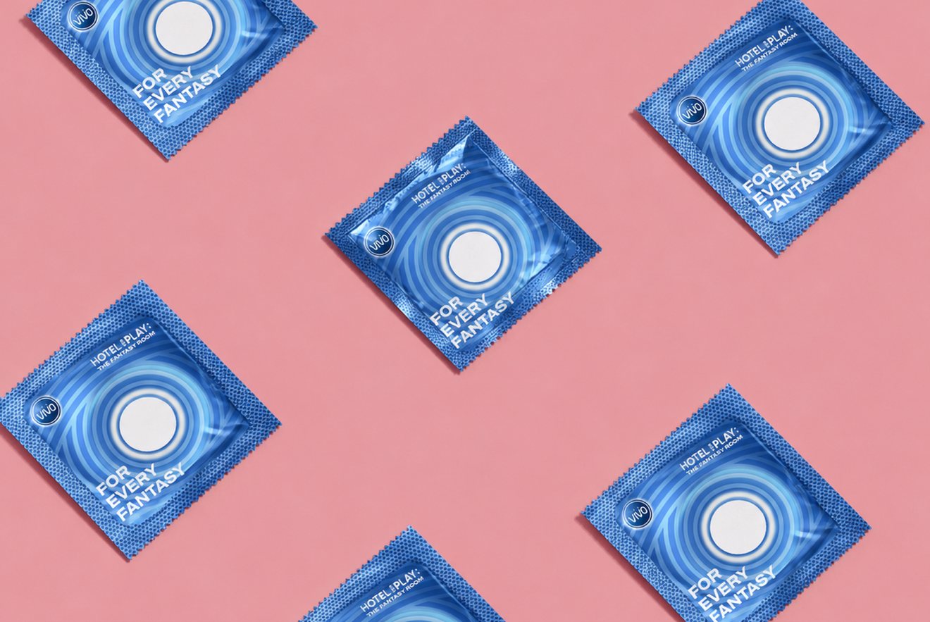 Hotel for Play sachet merchandise laid out on pink