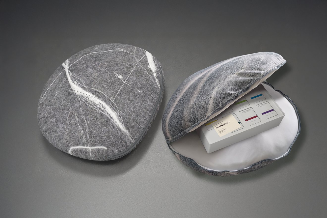 Scentarium fragrance kit revealed inside an opened stone shell