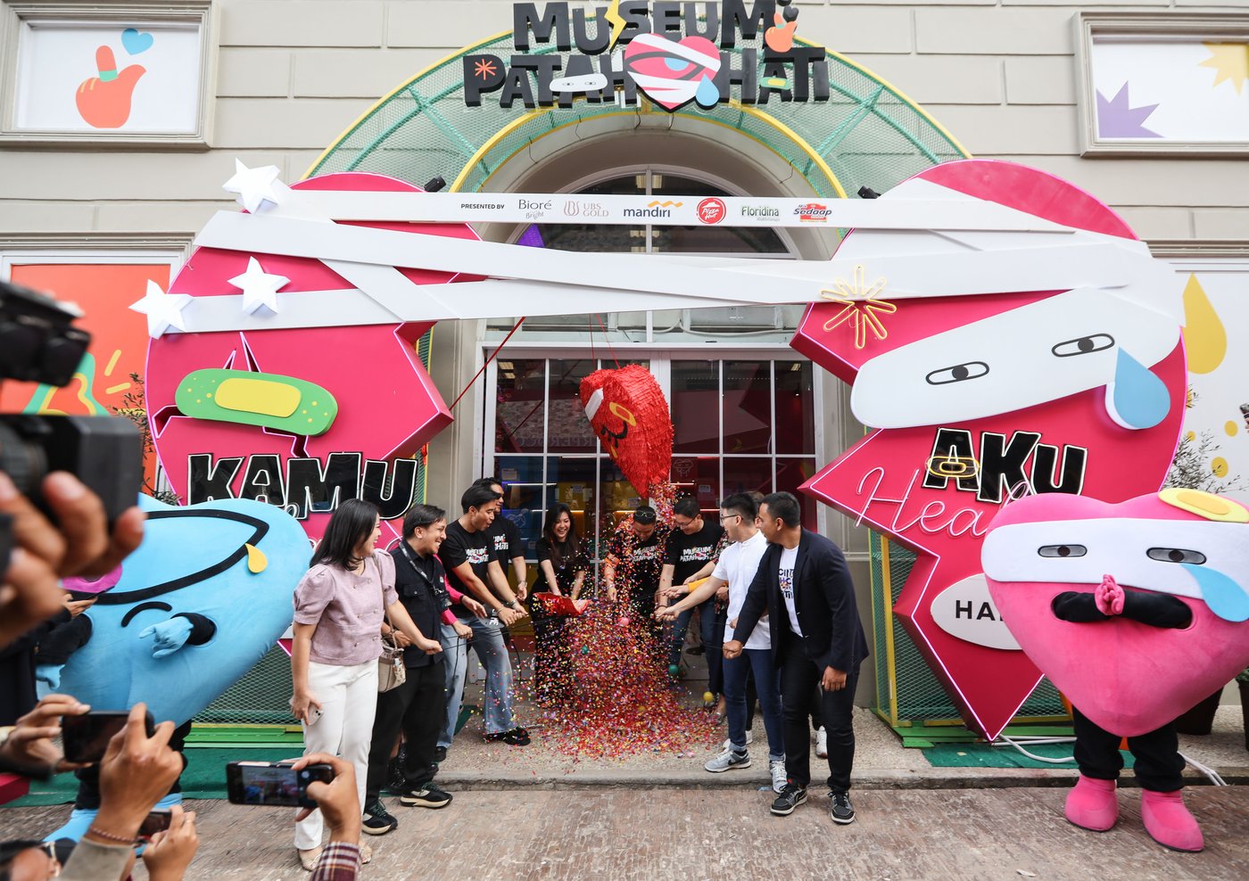 Museum Patah Hati entrance archway at the opening, with mascots and ribbon-cutting