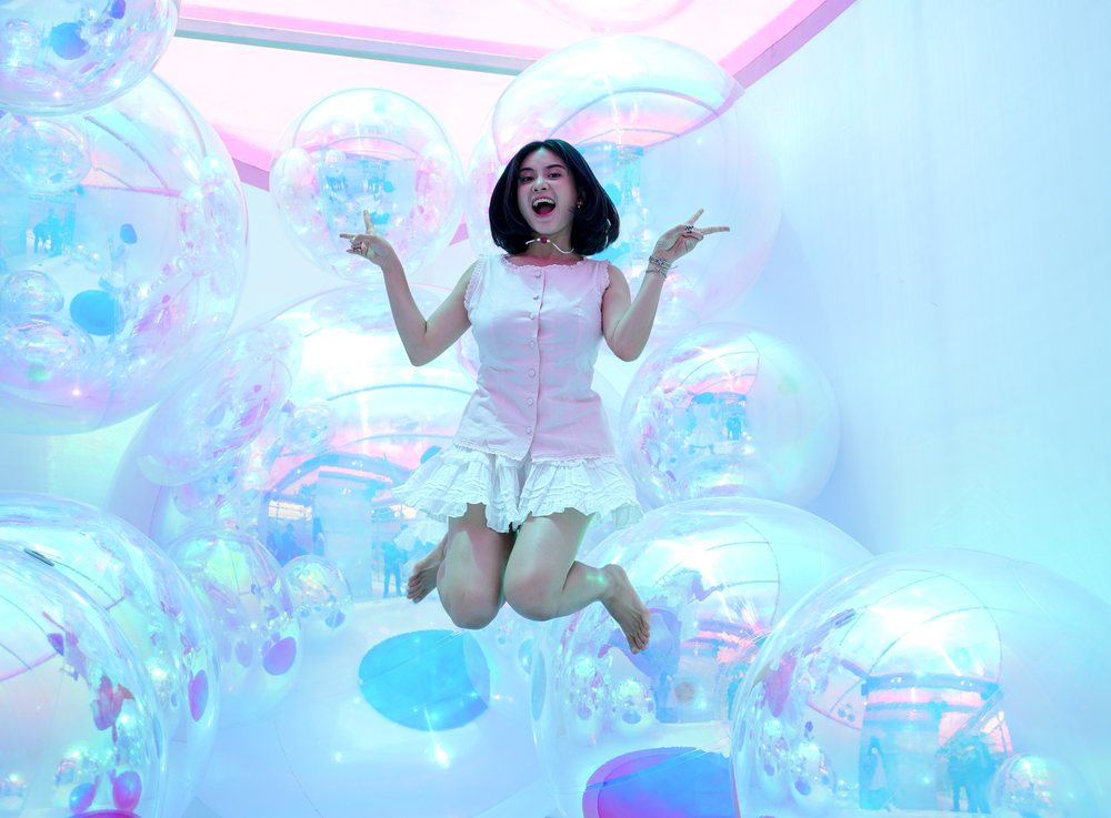 Visitor jumping among transparent bubbles in the bounce zone